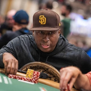 image of a man at a poker table with a san diego padres baseball hat on